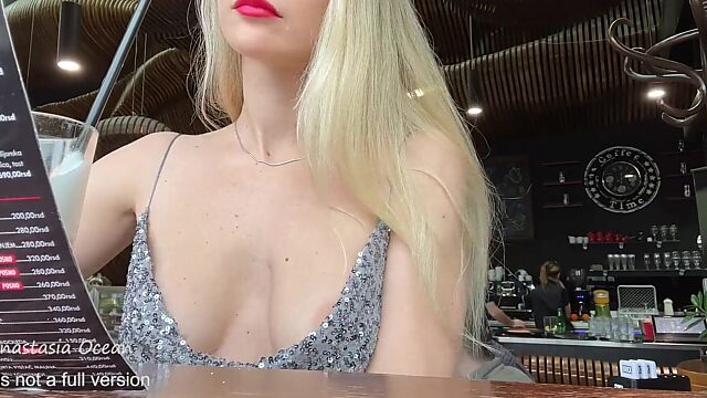 Blonde Flaunts Nips in Public Cafe - A Sensual Tease