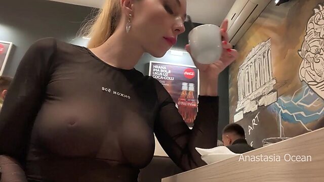 Exhibitionist Flashes Boobs in See-Through Top at Busy Cafe